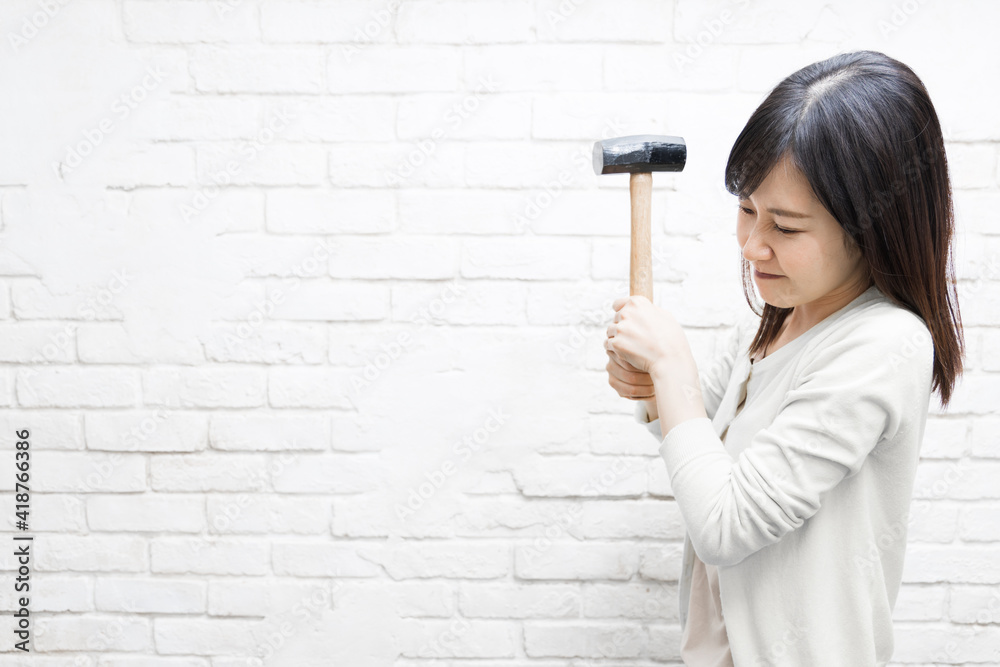 Woman wielding a hammer Woman wielding a hammer
