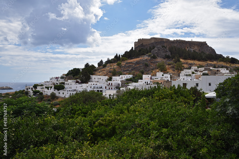 Beautiful view of the city on the hill, white houses, castle, ramparts
