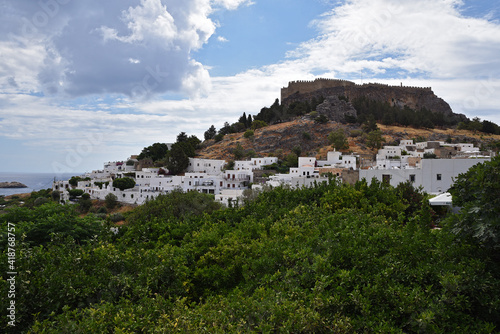 Beautiful view of the city on the hill, white houses, castle, ramparts