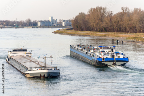 Barge boat sailing on the Rhine between Germany and France