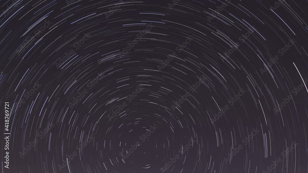 Timelapse of moving star trails in night sky. Timelapse of moving star trails in night sky.