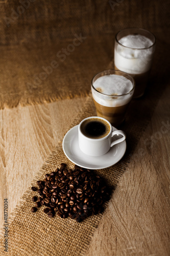 Coffee beans, espresso, cappuccino, latte on the table