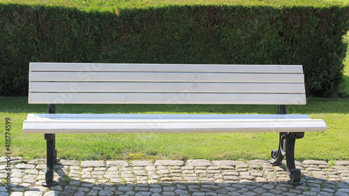 An empty park bench. A place of rest and recreation.