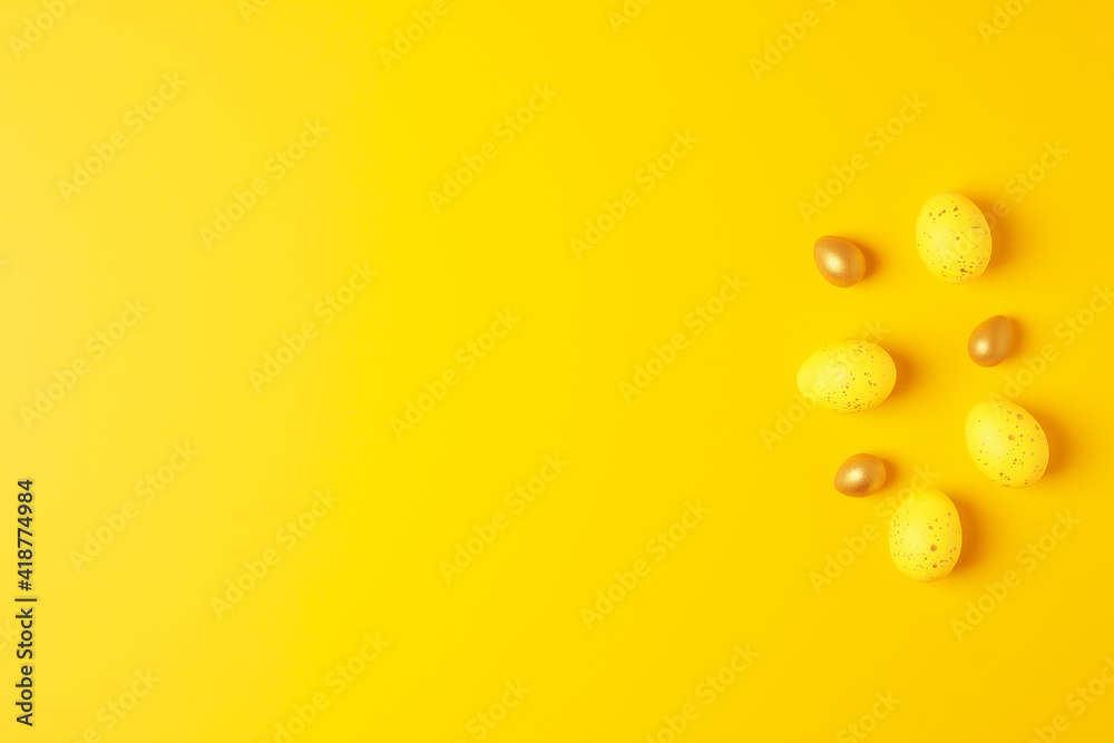 Easter yellow eggs on a yellow background. Flat lay, copy space.