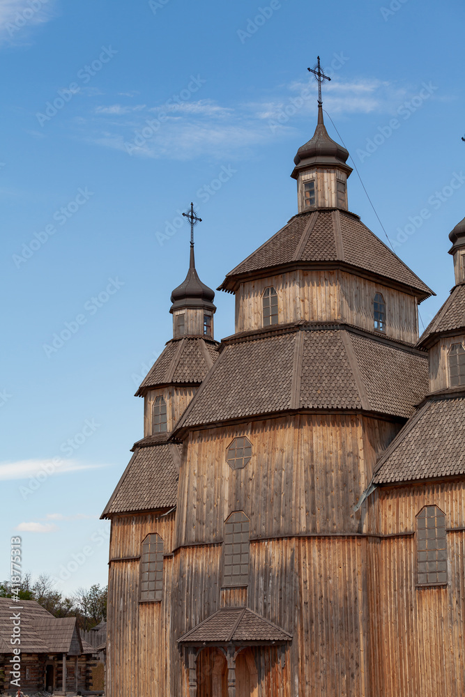Old wooden church against blue sky