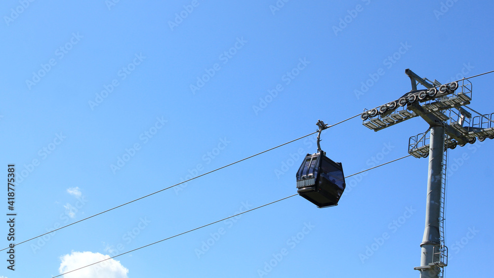 Ski-lift carriages on a background of blue sky in summer Ski-lift carriages on a background of blue sky in summer