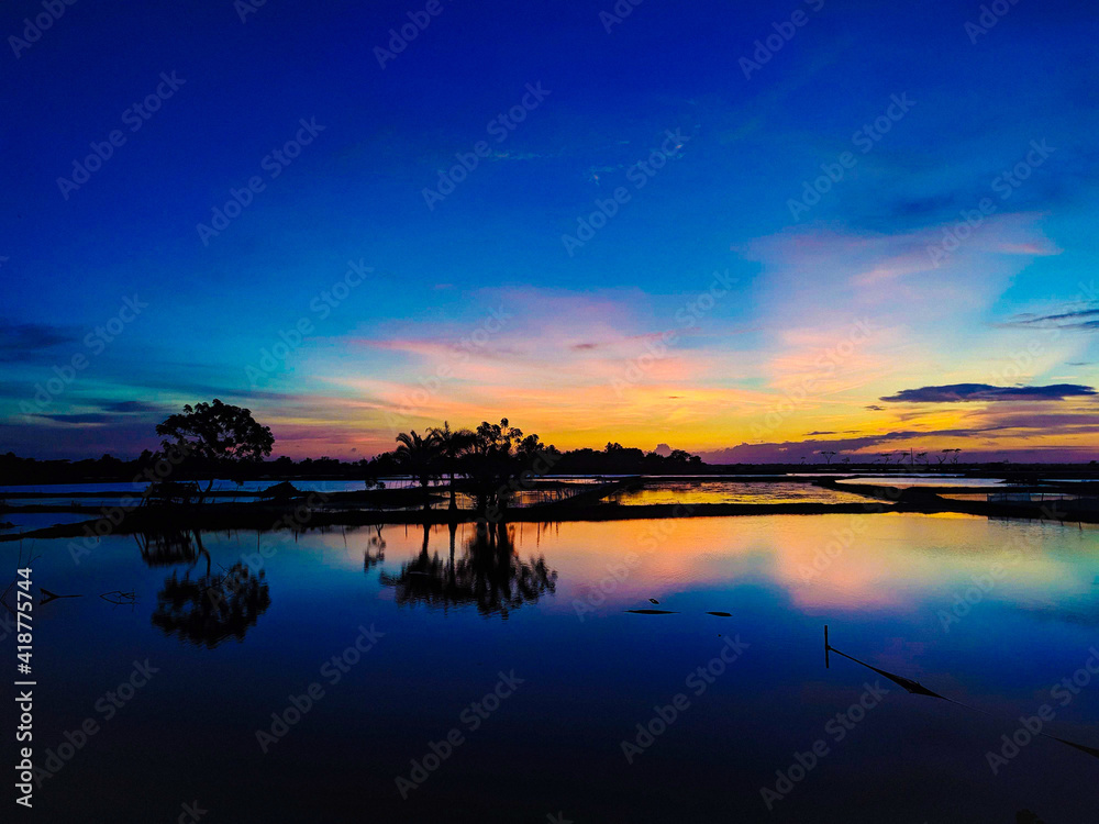Fototapeta premium sunset over the river