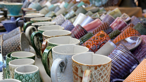 Ceramic cups on a market table.