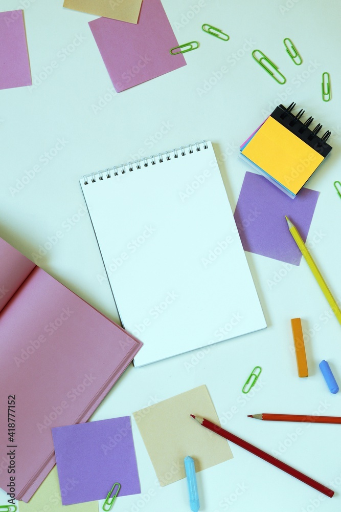 Stationery, blank notepads on the table, top view Stationery, blank notepads on the table, top view
