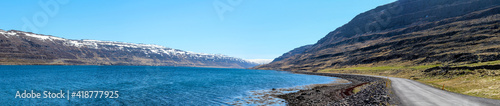 Panoramic view of a gravelled road at a fjord, Westfjords