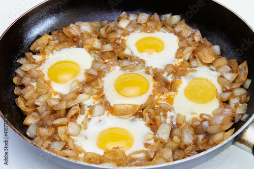 Fried eggs in a large frying pan