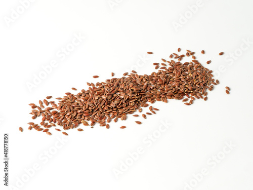 Flax seeds isolated on white background. © Danil
