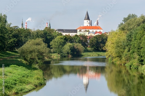 Wiew of the tower and chimneys of the city from the bridge over the Becva River. Prerov. Central Moravia. Czechia. Europe. 