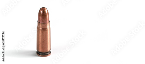 Billede på lærred Bronze pistol bullet isolated on white, space for text right side