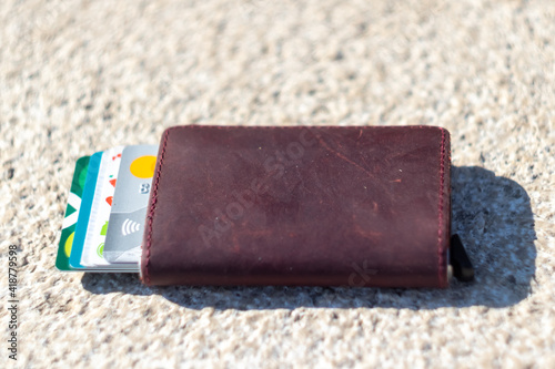 Forgotten wallet with credit cards on the ground close up