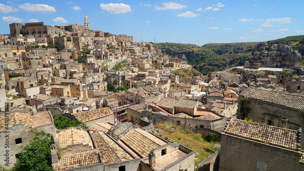 Sassi di Matera aerial panoramic cityscape with warm sunset colour ,popular tourist travel place, guided tour concept, Basilicata, Italy
