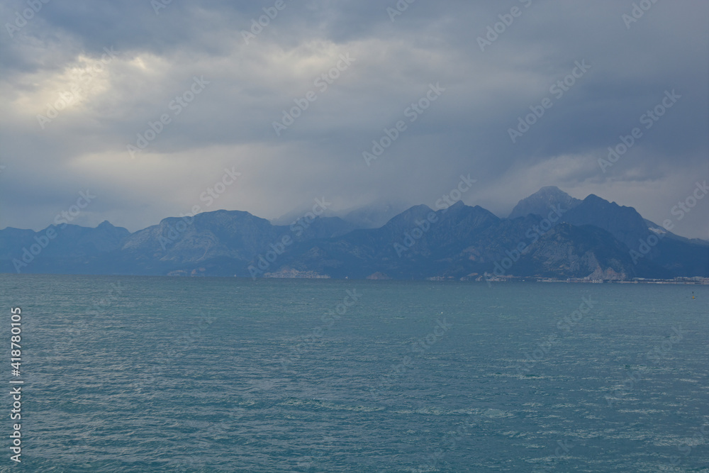 sea and mountains with foggy weather