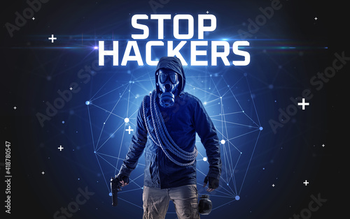 Mysterious hacker with STOP HACKERS inscription, online attack concept inscription, online security concept