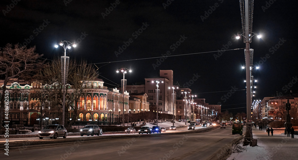 Yekaterinburg, Russia. Lenin Avenue, historical building Sevastyanov House with evening illumination.