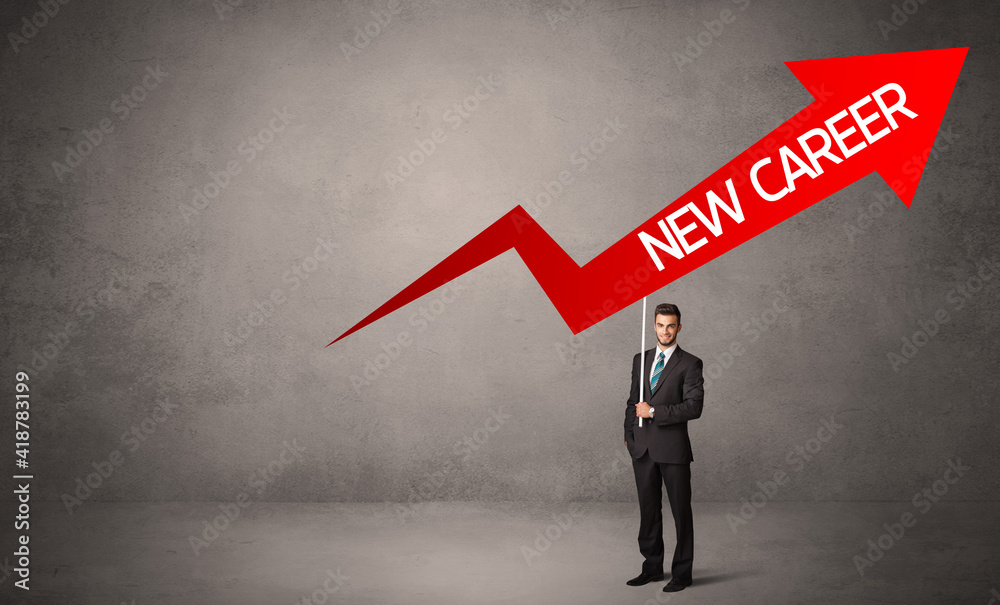 Obraz premium Young business person in casual holding road sign with NEW CAREER inscription, business direction concept