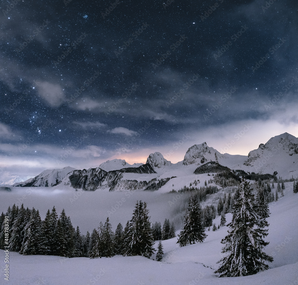 winter panorama landscape in the alps of switzerland after sunset
