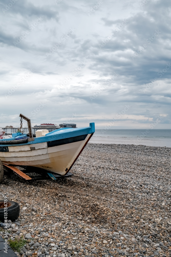 Cromer, Norfolk, UK – July 25 2020. An editorial photo of a view of a close up of the front end of a traditional crab fishing boat on Cromer beach on the North Norfolk coast