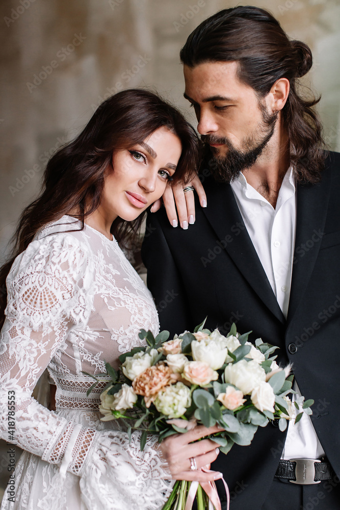 Beautiful young couple. Bride and groom. Newlyweds. New family. Human relationships Beautiful young couple. Bride and groom. Newlyweds. New family. Human relationships