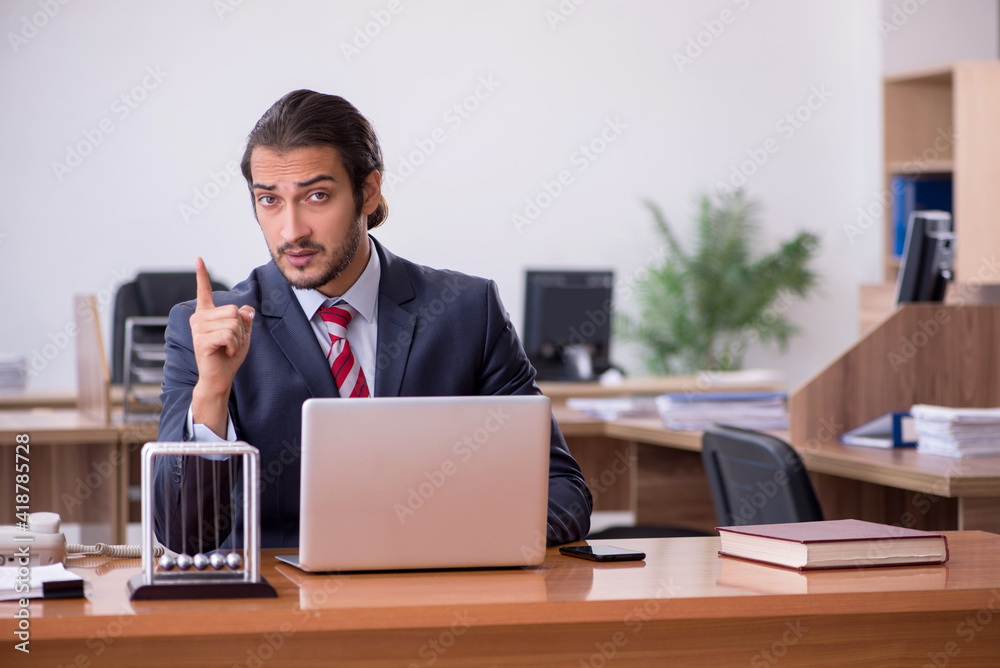 Young man businessman employee sitting in the office Young man businessman employee sitting in the office