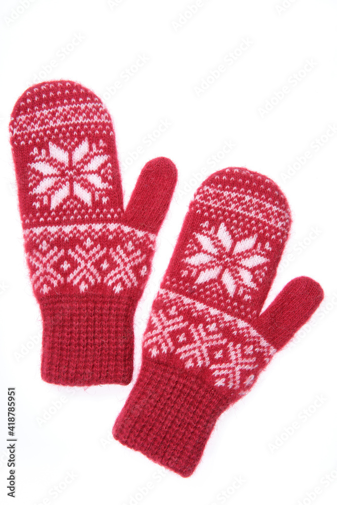 Warm woolen knitted mittens isolated on white background. Red kn Warm woolen knitted mittens isolated on white background. Red kn
