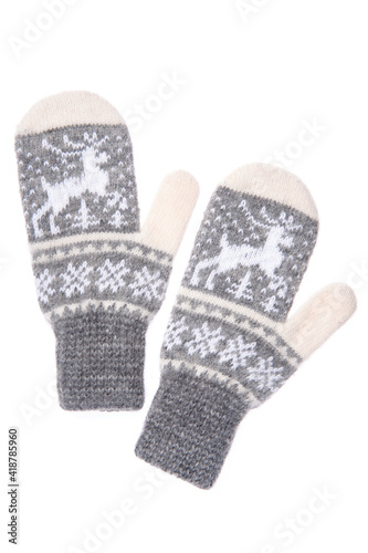 Warm woolen knitted mittens isolated on white background. Gray k