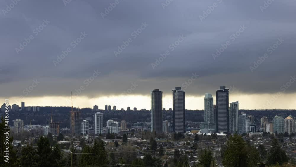 Burnaby, Vancouver, British Columbia, Canada. Time Lapse. Beautiful Panoramic Aerial View of a modern city during a stormy and rainy day. Cityscape Buildings Burnaby, Vancouver, British Columbia, Canada. Time Lapse. Beautiful Panoramic Aerial View of a modern city during a stormy and rainy day. Cityscape Buildings