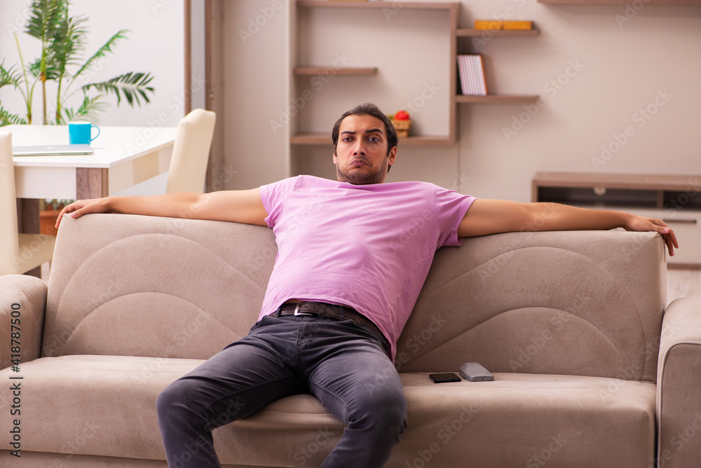 Young man staying at home during pandemic Young man staying at home during pandemic