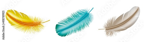 Set of realistic colorful feathers: blue and yellow bird plume isolated on white background