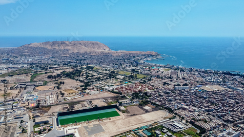 Aerial view of the Chorrillos district and the Lima coasts, in the background a mountain called photo