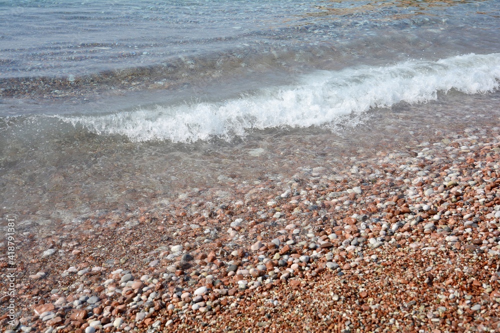 Coast. Waves hitting the pebbles. Sea waves. Coast. Waves hitting the pebbles. Sea waves.