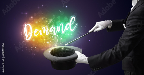Magician hand conjure with wand and Demand inscription, shopping concept