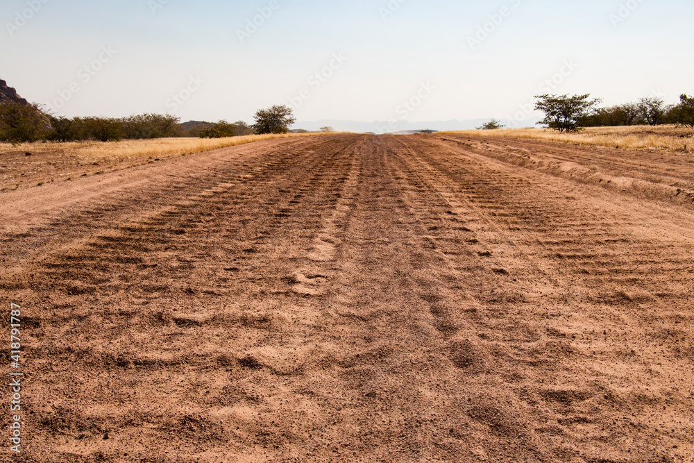 Road trip in Damaraland, Namibia - close up of a washboard gravel road  Stock Photo | Adobe Stock