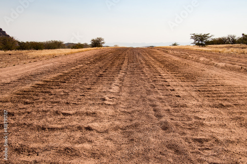 Road trip in Damaraland  Namibia - close up of a washboard gravel road