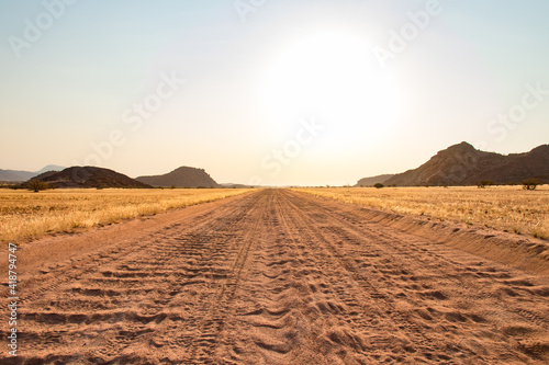 Road trip in Damaraland  Namibia - close up of a washboard gravel sand road in Namibia