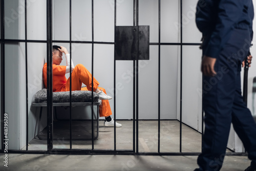 Obraz na plátně A male warden guards cells with dangerous criminals in a high-security prison