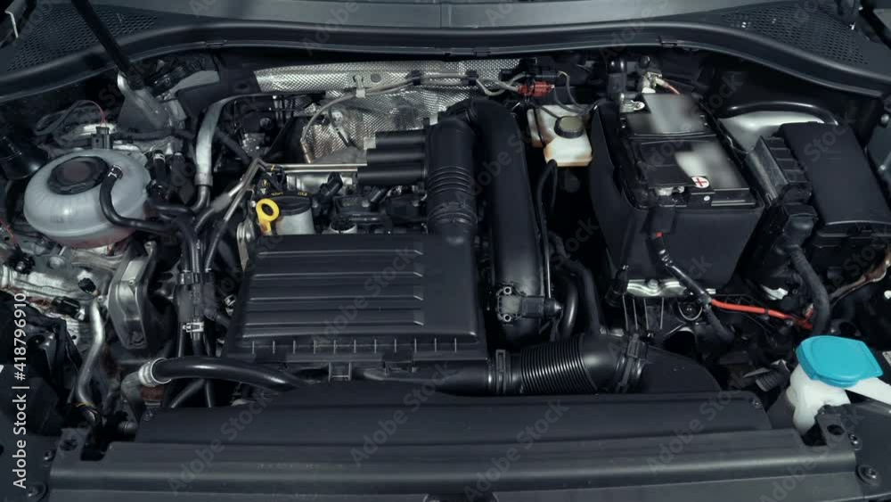Modern turbo car engine or motor space under vehicle hood close up. Modern turbo car engine or motor space under vehicle hood close up.