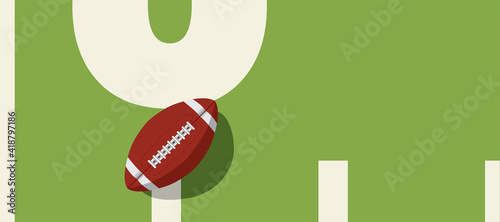 american football ball standing on white line.