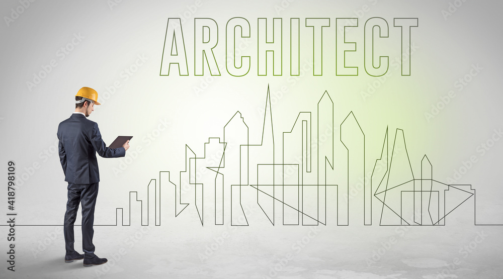 Businessman in hard hat holding blueprint with ARCHITECT inscription, engineering and architecture concept Businessman in hard hat holding blueprint with ARCHITECT inscription, engineering and architecture concept