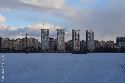 city       on the background of a frozen lake