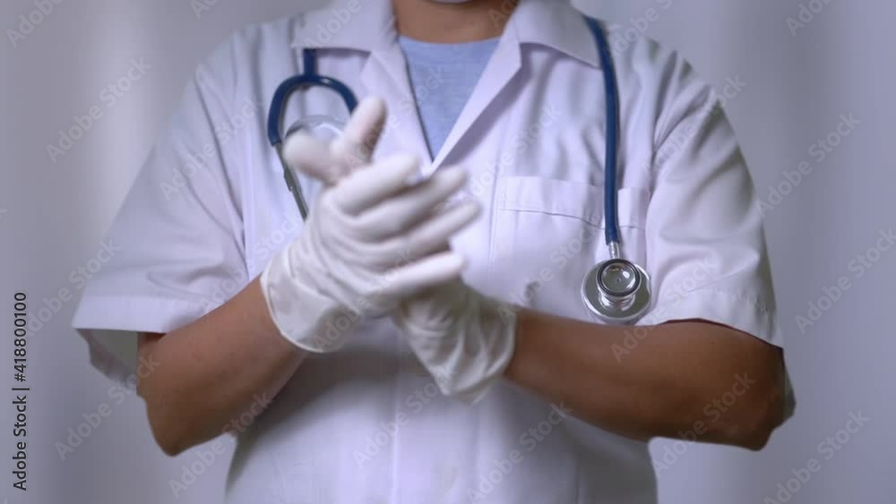 Slow motion, Female doctor or scientist in personal protective equipment clapping their hands to cerebrate.
Slow motion, Female doctor or scientist in personal protective equipment clapping their hands to cerebrate.