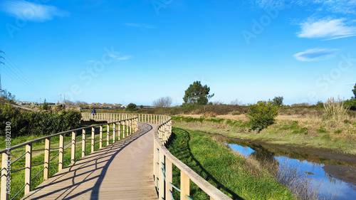 Obraz na płótnie The Ecovia do Cavado e do Homem (Cavado and Man's Ecoway) pathway at the Northern Litoral Natural Park in Fao, Esposende, Portugal. The large estuary of the Cávado river. w salonie