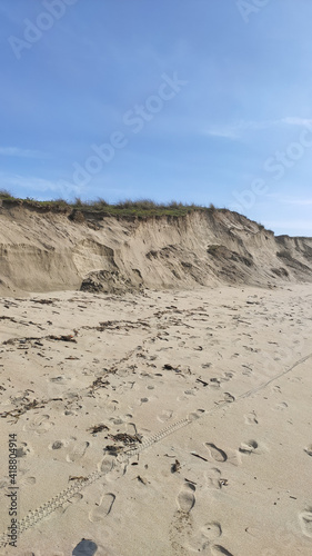 Post-storm eroded dune in Esposende, Portugal. Sand loss from a dune under wave attack.