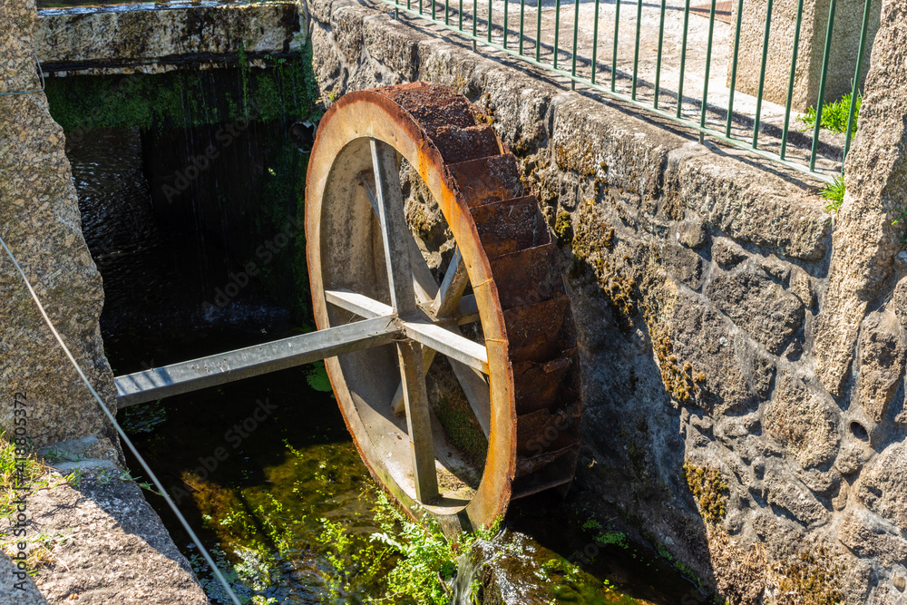 Water mill wheel in a large mansion estate near Esposende, Portugal