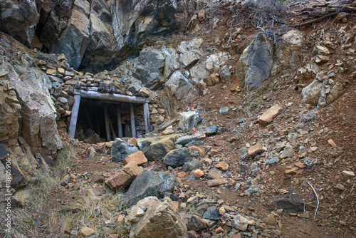 Entrance to old mine in mountains. Abandoned Hadjipavlou chromite mine in Troodos, Cyprus photo