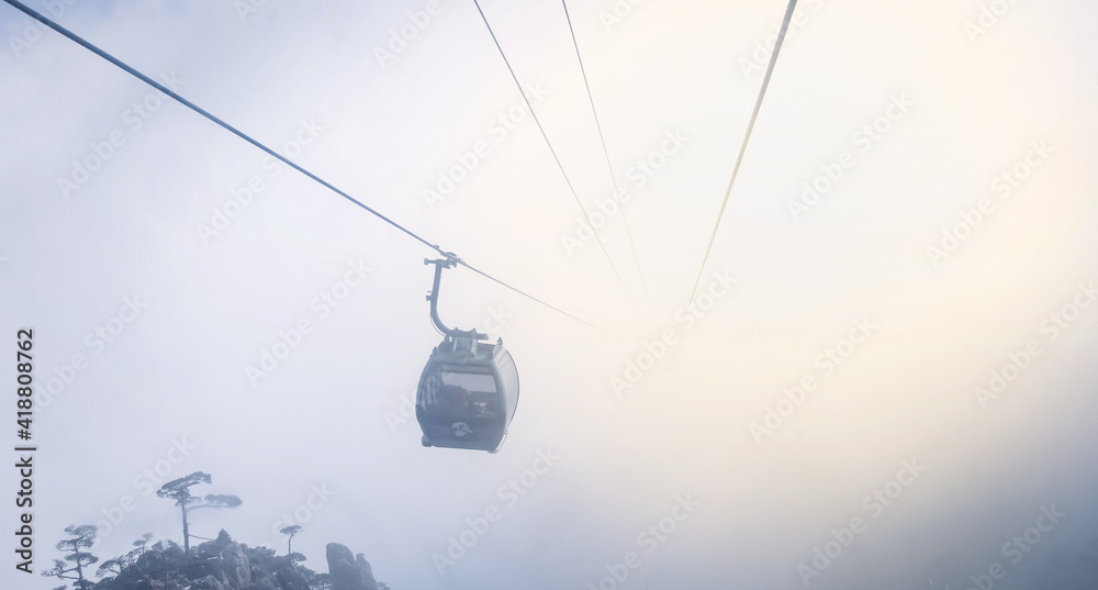 Scenic view of Huangshan yellow mountain cliffs in China from lift cable car and a lot of the mist in the winter season, Scenic view of Huangshan yellow mountain cliffs in China from lift cable car and a lot of the mist in the winter season,